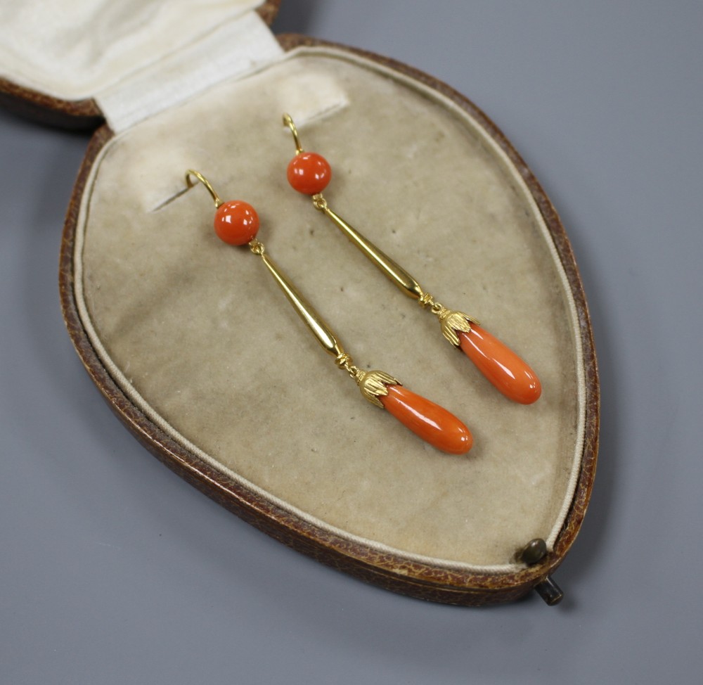 A pair of early-mid 20th century yellow metal (one stamped 15ct) and coral set drop earrings, overall 62mm, gros weight 6 grams.